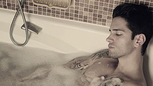 A-beautiful-man-getting-shower-after-tattoing