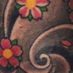 colorful tatt on arm - red color tattoo