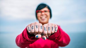 red-jacket-woman-with-finger-tattoo